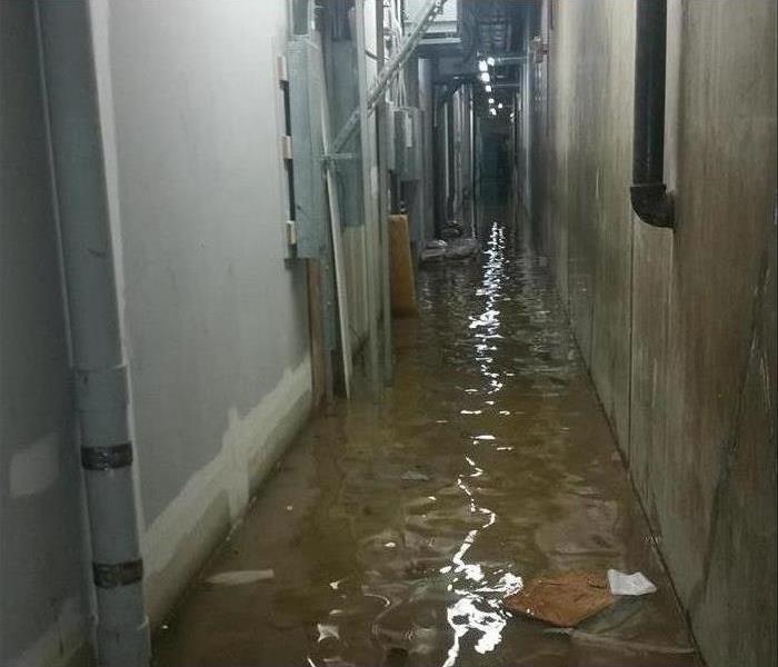 flooded concrete area service corridor