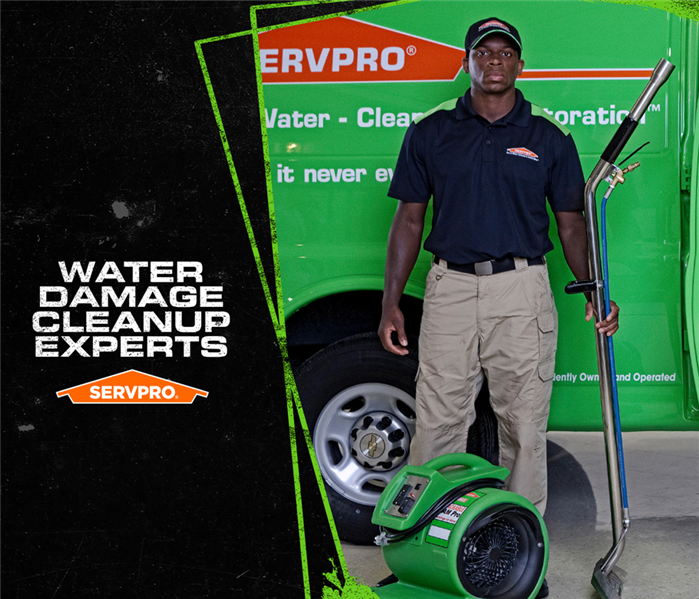 SERVPRO employee holding the top of a water extraction tool