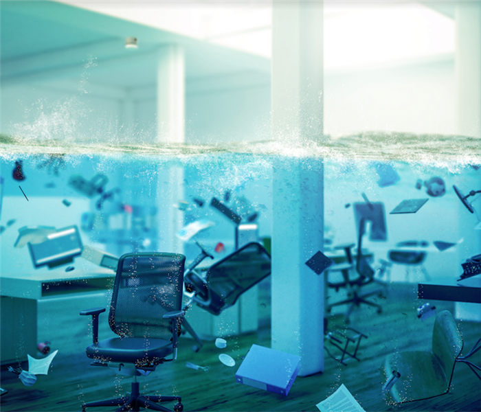 a flooded office with chairs and supplies floating everywhere